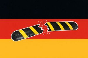 A broken speed bump over the German flag