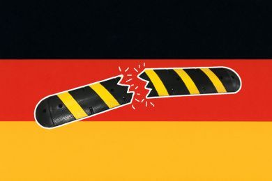 A broken speed bump over the German flag